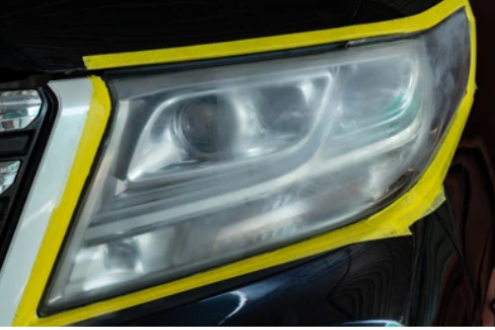 Cloudy yellowed headlight before restoration